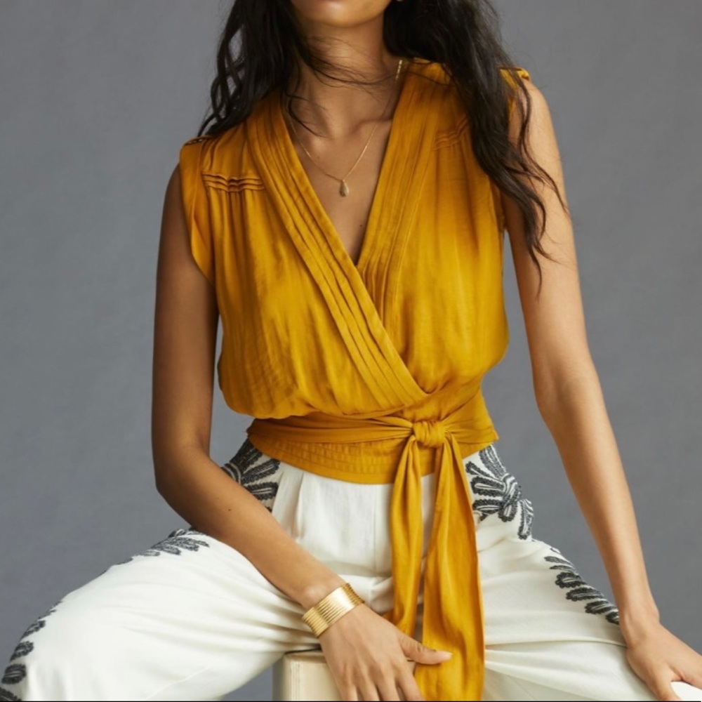 Anthropologie wrap blouse, size medium.  Gold in color.  Machine washable.